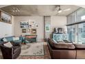 Cozy living room with plush seating, modern lighting, and access to the balcony at 1700 Bassett St # 513, Denver, CO 80202