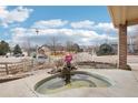A view of the front yard, landscaping, and a decorative water feature from the front porch at 2208 S Eldridge Ct, Lakewood, CO 80228