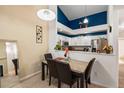 Charming dining area adjacent to the kitchen, perfect for intimate meals and gatherings at 5800 Tower Rd # 610, Denver, CO 80249