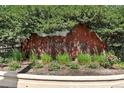 Landscaped metal sign for the Canyon Creek community at 8489 Canyon Rim Cir # 302, Englewood, CO 80112