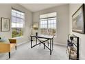 Bright home office with large windows, modern desk, and stylish decor at 5781 S Union Ter, Littleton, CO 80127
