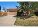 Charming single-story home featuring an attached two-car garage and well-maintained landscaping at 20137 E Prentice Pl, Centennial, CO 80015