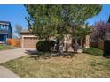 Charming single-story home featuring an attached two-car garage and well-maintained landscaping at 20137 E Prentice Pl, Centennial, CO 80015