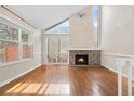 Spacious living room with fireplace and hardwood floors at 12780 E Bethany Pl, Aurora, CO 80014