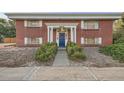 Attractive brick building with a blue front door and walkway at 450 W Jefferson Ave, Englewood, CO 80110