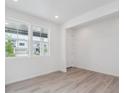 Bright living room with natural light, recessed lights, and wood-style flooring at 24777 E 40Th Ave, Aurora, CO 80019