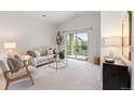 Bright living room with a sliding glass door leading to a balcony and neutral decor at 11364 Xavier Dr # 205, Westminster, CO 80031