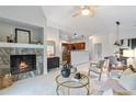 Stylish living room with a marble fireplace, modern furniture, and an open floor plan at 11364 Xavier Dr # 205, Westminster, CO 80031