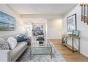 Open living room showing comfortable seating and views into the adjacent dining area at 186 S Nome St, Aurora, CO 80012