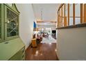 Inviting entryway with hardwood floors leads to a cozy living room with a staircase to the right at 9200 E Cherry Creek South Dr # 10, Denver, CO 80231