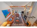 Elevated view of a living room featuring hardwood floors, a fireplace, and comfortable seating at 9200 E Cherry Creek South Dr # 10, Denver, CO 80231