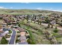 Panoramic aerial view of the community with lush greenery and mountain scenery at 2140 S Coors Cir, Lakewood, CO 80228