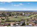 Expansive aerial view showcasing the neighborhood's layout and scenic surroundings at 2140 S Coors Cir, Lakewood, CO 80228