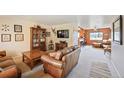 Inviting living room featuring a plush leather sofa and stylish decor at 2140 S Coors Cir, Lakewood, CO 80228