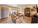 Cozy living room with ample seating, natural light, and elegant furnishings at 2140 S Coors Cir, Lakewood, CO 80228