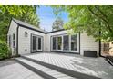 Spacious patio area with seamless indoor-outdoor transition through sliding glass doors, perfect for entertaining at 1016 S Cook St, Denver, CO 80209