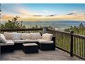 Relaxing deck area featuring comfortable outdoor seating and breathtaking panoramic views at 9001 Eastridge Rd, Golden, CO 80403
