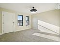 Bright and airy bedroom featuring neutral walls, plush carpeting, and windows bringing in natural light at 1559 N Hooker St, Denver, CO 80204