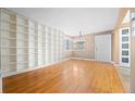 Inviting living room featuring hardwood floors, built-in bookshelves and great natural light at 536 Detroit St, Denver, CO 80206