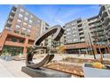 Modern condominium exterior featuring mixed materials, an 'Encore' sign, and attractive common areas at 20 Wilcox St # 208, Castle Rock, CO 80104