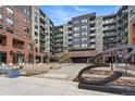 Modern condominium complex showing mixed materials, an 'Encore' sign, and attractive landscaping at 20 Wilcox St # 208, Castle Rock, CO 80104