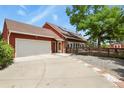 Beautiful home featuring solar panels, a two-car garage, and a charming front porch at 4664 S Union St, Morrison, CO 80465