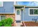 Close up of the house's front door, siding, and landscaping at 4259 S Richfield St, Aurora, CO 80013