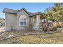 Charming home exterior features neutral siding, manicured landscaping, and a covered porch at 9742 E Hawaii Pl, Aurora, CO 80247