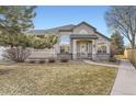 Charming single-Gathering home with a well-manicured lawn, inviting entryway, and attractive architectural details at 9742 E Hawaii Pl, Aurora, CO 80247