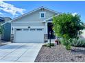 Charming single-Gathering home featuring a manicured front yard, covered porch, and a two-car garage at 15979 Xanthia Way, Thornton, CO 80602