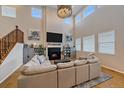 Comfortable living room with a fireplace and plenty of natural light, perfect for relaxing with Gathering and friends at 27185 E Costilla Dr, Aurora, CO 80016