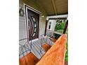 Welcoming front porch featuring a unique door design and comfortable seating at 4779 S Bannock St, Englewood, CO 80110