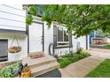 Inviting front entrance with a concrete walkway and steps leading to the front door at 10972 Fairfax Ct, Thornton, CO 80233