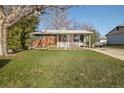 Inviting single-Gathering home with a well-maintained lawn and covered porch at 3778 S Hooker St, Englewood, CO 80110