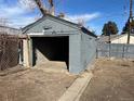 Open garage, with concrete floor and gray concrete block walls at 2915 W 4Th Ave, Denver, CO 80219