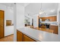 Open kitchen featuring wooden cabinets, stainless steel appliances, and eat in kitchen dining area at 8761 Cloverleaf Cir, Parker, CO 80134