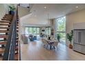 Open-concept living and dining area with modern decor, large windows, and stainless steel appliances at 5125 W 29Th Ave # 1, Denver, CO 80212