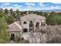 Stunning luxury home with a grand entrance, well-manicured landscaping, and a multi-car garage at 937 Aztec Dr, Castle Rock, CO 80108