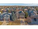 Aerial view of a two-story home in a neighborhood with mature trees and well-maintained lawns at 17724 E Oakwood Pl, Aurora, CO 80016