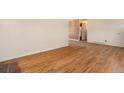 Hardwood floors and light-filled open space in this living room, ready for your personal touch at 6185 Sheridan Blvd, Arvada, CO 80003