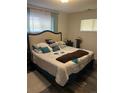 Cozy bedroom featuring a plush queen-size bed and neutral decor at 9041 Lilly Ct, Thornton, CO 80229