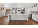 Open kitchen featuring stainless steel appliances, a large island, and modern cabinetry at 741 S 6Th Ave, Brighton, CO 80601