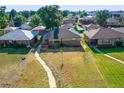 Aerial view of a ranch style home and surrounding houses at 3667 N Monaco St, Denver, CO 80207