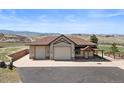 Ranch style home, with a three-car garage and mountain views at 6330 Old Orchard Ln, Sedalia, CO 80135