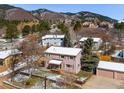 Aerial view of a house showing the exterior, yard, and surrounding neighborhood at 16 Prairie St, Palmer Lake, CO 80133