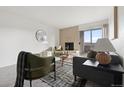Living room features a fireplace and balcony access at 1313 N Williams St # 703, Denver, CO 80218