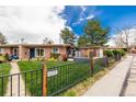 Attractive home featuring a well-maintained lawn, wrought iron fence, and clear street number at 6005 W 39Th Ave # 6005, Wheat Ridge, CO 80033