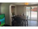 Bright dining room featuring a table with seating and sliding glass doors to the outside at 449 Lowell Blvd, Denver, CO 80204