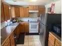 Traditional kitchen with wooden cabinetry, modern appliances and a neutral color palette at 449 Lowell Blvd, Denver, CO 80204