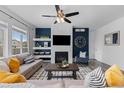 Cozy living room featuring a modern fireplace, stylish decor, and comfortable seating at 17960 Weymouth Ave, Parker, CO 80134